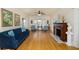 Cozy living room featuring hardwood flooring, a classic fireplace, and elegant decor at 6342 5Th N Ave, St Petersburg, FL 33710