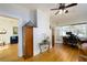 Bright living room featuring wood floors, a decorative table, and a glimpse of an adjacent room at 6342 5Th N Ave, St Petersburg, FL 33710