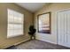 Bedroom featuring neutral walls, carpet flooring, a window, and beach themed decor at 7510 Red Mill Cir, New Port Richey, FL 34653