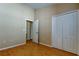 Bedroom featuring neutral walls, wood flooring, and closet at 7510 Red Mill Cir, New Port Richey, FL 34653