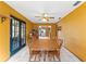 Bright dining area featuring tile floors, stylish decor, and natural light at 8449 Valmora St, Spring Hill, FL 34608