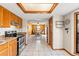 Open kitchen featuring stainless steel appliances and tiled floors at 8449 Valmora St, Spring Hill, FL 34608