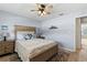 Comfortable bedroom featuring natural wood furniture and a light, airy ambiance at 9950 62Nd N Ter # 203, St Petersburg, FL 33708