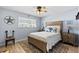 Serene bedroom with a comfortable bed, matching nightstands, and soft, natural light at 9950 62Nd N Ter # 203, St Petersburg, FL 33708