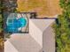 Aerial view of a screened in pool and neutral color palette home at 10159 Hernando Ridge Rd, Weeki Wachee, FL 34613