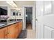 Bathroom featuring dual sinks and granite countertops at 10159 Hernando Ridge Rd, Weeki Wachee, FL 34613