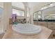 Beautiful bathroom showcasing an elegant tub, vanity, and natural light from the window at 10159 Hernando Ridge Rd, Weeki Wachee, FL 34613