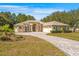 Charming one-story home with well-manicured landscaping and an elegant circular driveway at 10159 Hernando Ridge Rd, Weeki Wachee, FL 34613