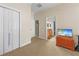 Hallway leads to a bathroom with dual sinks, a closet, and light-colored carpet at 10159 Hernando Ridge Rd, Weeki Wachee, FL 34613