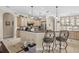 Kitchen area with granite countertops, stainless steel appliances, light wood cabinets, and tile flooring at 10159 Hernando Ridge Rd, Weeki Wachee, FL 34613