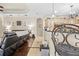 Open-concept living room that flows into the kitchen area, featuring hardwood floors and neutral colors at 10159 Hernando Ridge Rd, Weeki Wachee, FL 34613