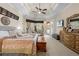 Inviting main bedroom with neutral colors, a ceiling fan, and a backyard view at 10159 Hernando Ridge Rd, Weeki Wachee, FL 34613