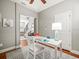 Home office featuring hardwood floors, neutral paint, and natural light from the entryway at 10193 Grand Oak Cir, Madeira Beach, FL 33708