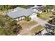 Aerial view of a well-kept property with a manicured lawn and gray roof at 10222 95Th St, Seminole, FL 33777