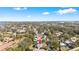 Aerial view of a well-situated home nestled among lush greenery in a tranquil neighborhood at 10222 95Th St, Seminole, FL 33777