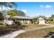 Well-maintained single-story home featuring a beautifully landscaped front yard at 10222 95Th St, Seminole, FL 33777