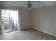 Bedroom with carpet and a sliding glass doors to a balcony at 10265 Gandy N Blvd # 1806, St Petersburg, FL 33702