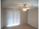 Bedroom with neutral carpet, a ceiling fan, and sliding glass doors to the patio at 10265 Gandy N Blvd # 1806, St Petersburg, FL 33702