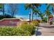 Entrance to Itopia Private Residences, a community with beautiful landscaping, palm trees and sidewalks at 10265 Gandy N Blvd # 1806, St Petersburg, FL 33702