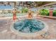 Relaxing jacuzzi spa with tiled surround, under a pergola, beside a sparkling pool at 10265 Gandy N Blvd # 1806, St Petersburg, FL 33702