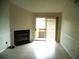 Living room featuring tiled floors, fireplace, and a sliding glass door to a patio at 10265 Gandy N Blvd # 1806, St Petersburg, FL 33702