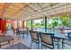 Spacious covered patio for entertaining, featuring ample seating and views of the community pool at 10265 Gandy N Blvd # 1806, St Petersburg, FL 33702