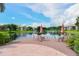 Scenic view of a pond with a seating area, offering a serene and relaxing outdoor space at 10265 Gandy N Blvd # 1806, St Petersburg, FL 33702