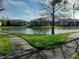 Scenic view of pond surrounded by condo buildings and walking path at 10265 Gandy N Blvd # 1806, St Petersburg, FL 33702