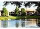 Peaceful pond with fountain, reflecting surrounding condo buildings and verdant landscaping at 10265 Gandy N Blvd # 1806, St Petersburg, FL 33702