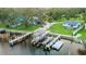 Aerial view shows the property's boat lift and private boat dock for easy access to waterfront activities at 10501 Bridgewood Dr, Riverview, FL 33578