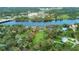 Scenic aerial view of the property with waterfront access, a boat dock, and large land, perfect for outdoor enthusiasts at 10501 Bridgewood Dr, Riverview, FL 33578