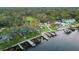 Aerial view features the property's location with a boat dock, multiple homes, and gorgeous waterfront views at 10501 Bridgewood Dr, Riverview, FL 33578