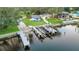 Aerial view showing the property's location with a private dock and boat lift for easy boating access at 10501 Bridgewood Dr, Riverview, FL 33578