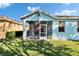 A view of the backyard with a screened in patio at 11542 Captiva Kay Dr, Riverview, FL 33569