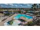 An aerial view of the community's pool area featuring a play area, water features, and lots of lounging space at 11542 Captiva Kay Dr, Riverview, FL 33569