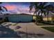 Charming single-story home with a two-car garage, lush landscaping, and a beautiful sky at 11542 Captiva Kay Dr, Riverview, FL 33569