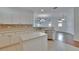 Bright kitchen features white cabinets, backsplash and a central island at 11542 Captiva Kay Dr, Riverview, FL 33569