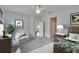 Cozy main bedroom with plush carpeting, neutral tones, and a decorative ceiling fan at 11542 Captiva Kay Dr, Riverview, FL 33569