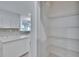 Walk-in pantry with adjustable metal shelving at 11542 Captiva Kay Dr, Riverview, FL 33569