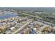 Panoramic aerial view of a residential neighborhood near a body of water and green areas at 13526 Alberta Ave, Port Charlotte, FL 33981