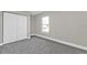 Neutral carpeted room with closet and window at 13526 Alberta Ave, Port Charlotte, FL 33981