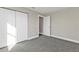 Empty bedroom with neutral paint, carpet, and a closet at 13526 Alberta Ave, Port Charlotte, FL 33981