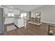 Bright kitchen and dining area featuring white cabinets, granite countertops, and a view outside at 13526 Alberta Ave, Port Charlotte, FL 33981