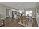 Open concept kitchen and dining area with modern white cabinets and a breakfast bar at 13526 Alberta Ave, Port Charlotte, FL 33981