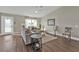 Comfortable living room showcasing neutral tones, a ceiling fan, and ample natural light at 13526 Alberta Ave, Port Charlotte, FL 33981