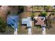 Aerial view showing rooftops of homes with driveways and solar panels at 17319 Terry Ave, Port Charlotte, FL 33948