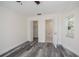 Cozy bedroom featuring modern gray floors, a ceiling fan, and a closet at 17319 Terry Ave, Port Charlotte, FL 33948