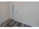 Bright entryway featuring a decorative glass door and stylish gray wood-look flooring at 17319 Terry Ave, Port Charlotte, FL 33948