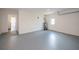 Spacious garage with epoxy floor, overhead door, and service door at 17319 Terry Ave, Port Charlotte, FL 33948