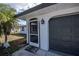 Welcoming entryway with a screened door and a convenient two-car garage at 17319 Terry Ave, Port Charlotte, FL 33948